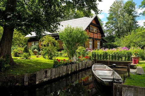 Spreewald house with boat on Fliess river