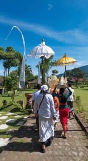 Procession of devout Buddhists with offerings