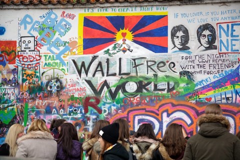 People visiting John Lennon Wall