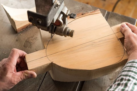 Cutting a wooden block using a band saw