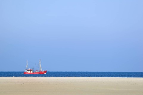Red fishing boat in the North Sea