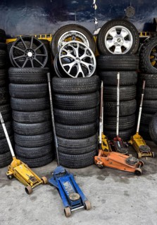 Stacked tires and car jacks