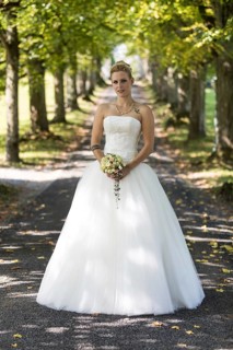 Young blonde woman in a white wedding dress