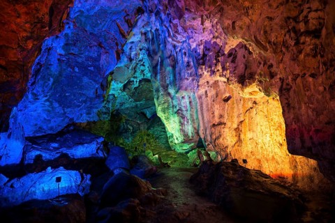Colorfully illuminated cave