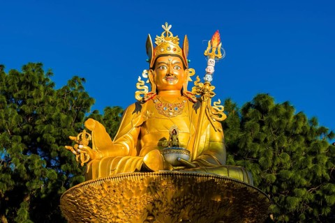 Big golden statue of Padmasambhava at back of Swayambhunath temple