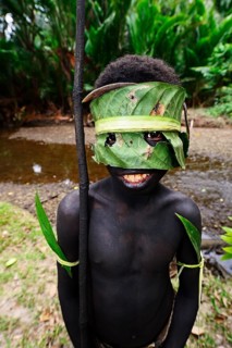Korafe-child with facial and headdress made of leaves