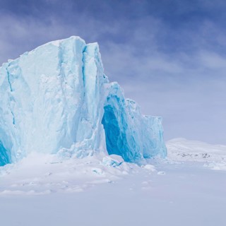 Iceberg in a frozen fjord