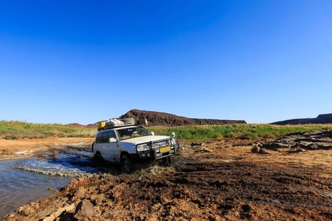 SUV crossing water