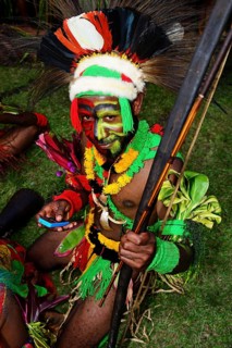 Mehiwaga warrior typing into his smartphone