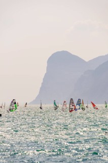 Many windsurfers with colourful sails