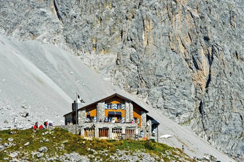 Carschinahutte in front of rock wall of Sulzfluh