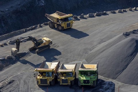 Tipper loader and excavator in a basalt quarry