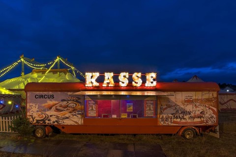Counter of a travelling circus illuminated at dusk