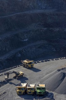 Tipper loader and excavator in a basalt quarry