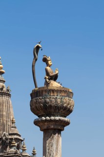 Statue of King Yoganarendra Malla with snake and bird