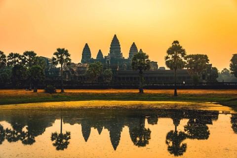 Temple complex of Angkor Wat reflected in the water basin