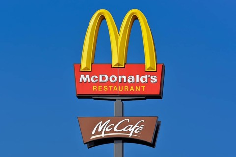 McDonalds sign against a blue sky