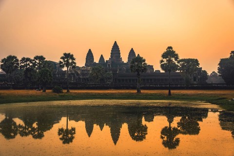 Temple complex of Angkor Wat reflected in the water basin