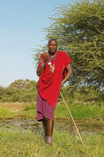 Male Maasai in traditional Shuka clothing with shepherd's crook