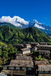 View on the historical village with the mountains Annapurna South