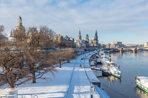 Snowy historic centre with Elbe and pier for steamboats