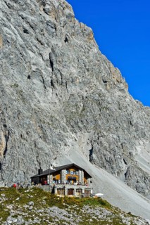 Carschinahutte in front of rock wall of Sulzfluh