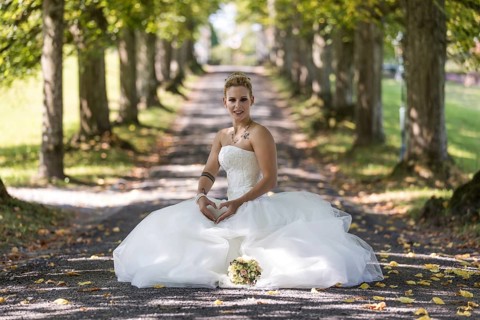 Young blonde woman in white wedding dress