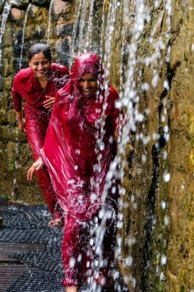 Two female pilgrims running through the 108 holy wells