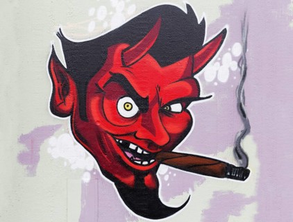 Red devil smoking cigar