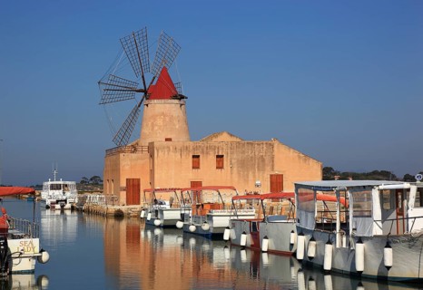 Windmill and boats at the salt flats