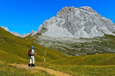 Hiker in front of the summit Sulzfluh