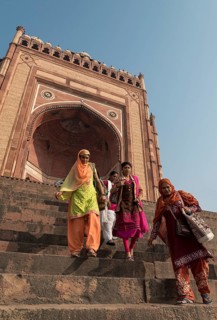 Indian women descending stairs from Buland Darwaza