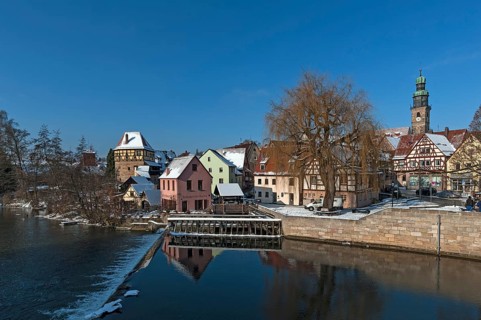 City scape with river and old grinding mill