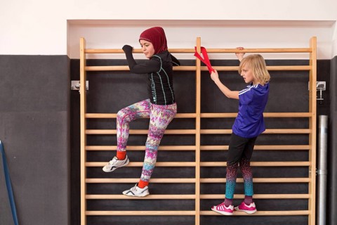 Students at the wall bars