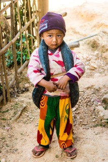 Little boy with inner tube of tire as toys around neck