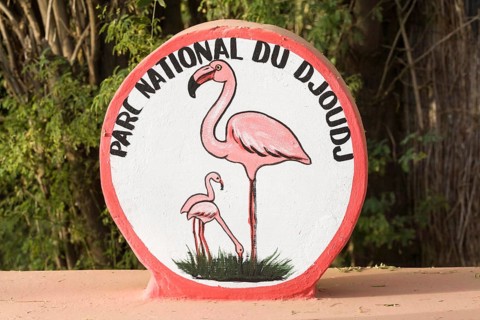 Painted sign with flamingos at entrance to Parc National du Djoudj