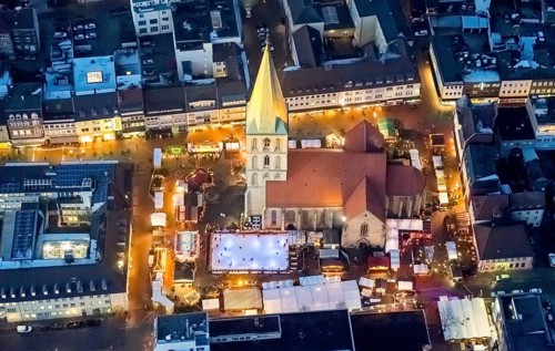 Christmas market with ice rink at St. Paul's church at night