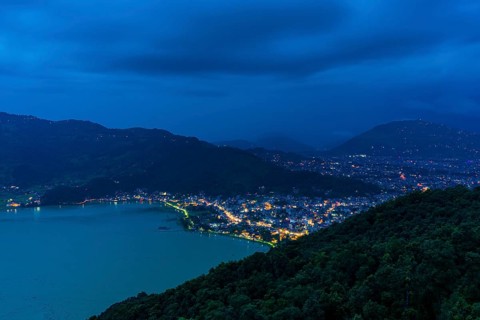 View on the illuminated city and the Phewa Lake at night