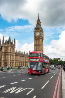 Red double-decker bus on the Westminster Bridge