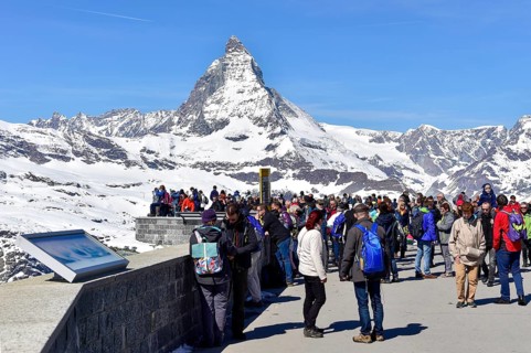 Tourists on the Gornergrat ridge with Matterhorn in the background