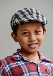Boy with shirt and flat cap