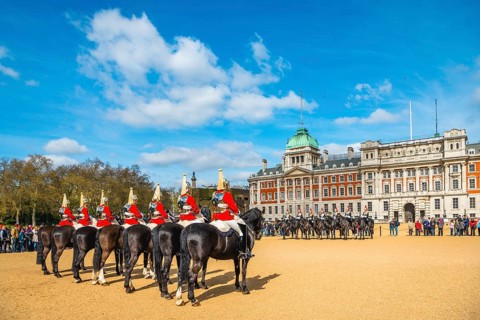 Royal Guards in red uniform on horses