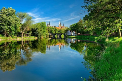 Merseburg Cathedral and Merseburg Castle are reflected in the River Saale