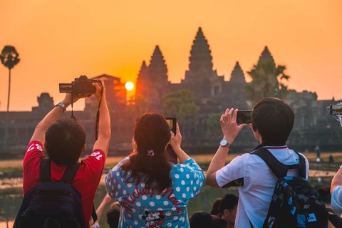 Tourists take pictures Angkor Wat