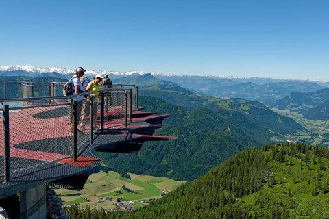 Tourists looking over the edge of the viewing platform