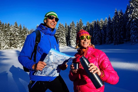 Two hikers on a premium winter hiking trail