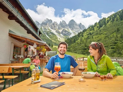 Hikers taking break at mountain hut