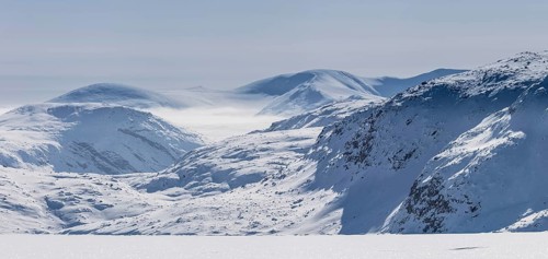 Panoramic view of mountains of Baffin seen from frozen fjord