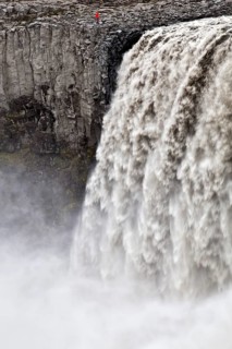 Person at the waterfall Dettifoss