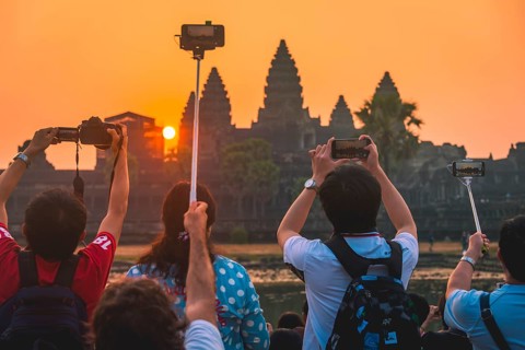 Tourists take pictures of Angkor Wat